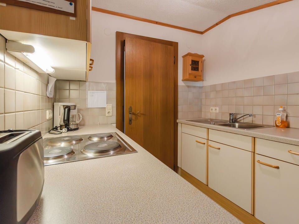 Countertop, Cabinetry, Tap, Sink, Furniture, Property, Building, Plumbing Fixture, Kitchen, Wood