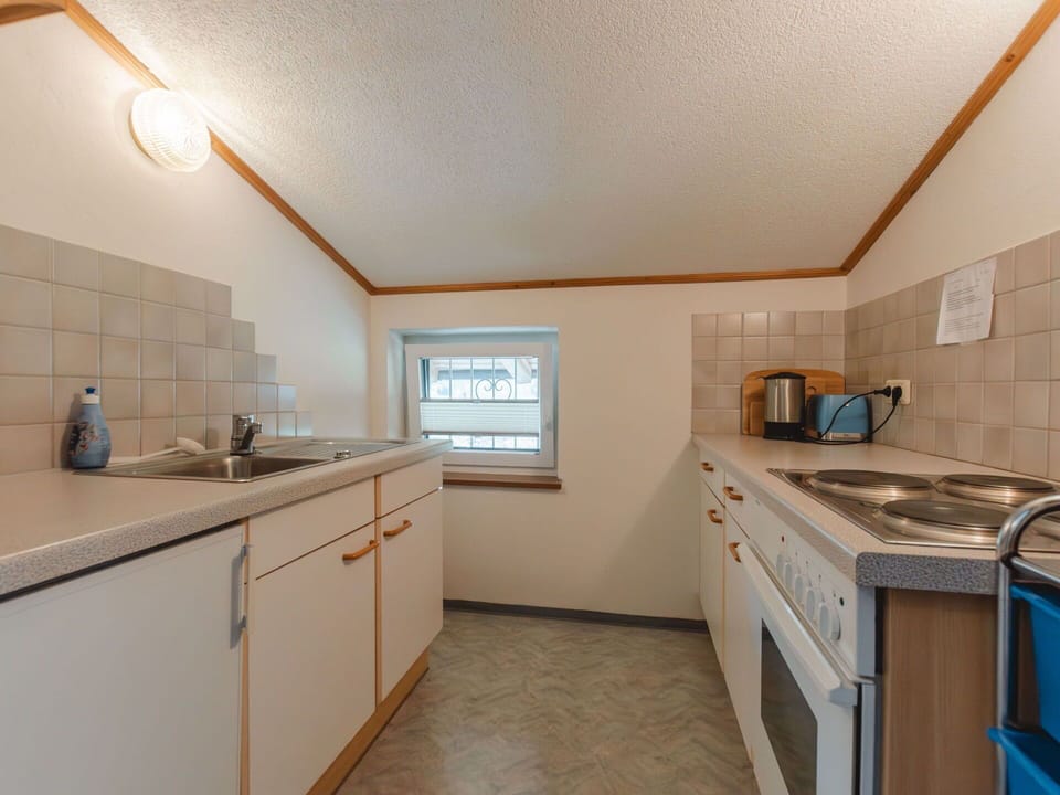 Cabinetry, Countertop, Sink, Kitchen Sink, Kitchen, Wood, Kitchen Appliance, Drawer, Kitchen Stove, Flooring
