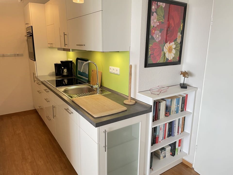 Cabinetry, Kitchen Sink, Sink, Furniture, Tap, Countertop, Picture Frame, Kitchen Stove, Kitchen Appliance, Interior Design