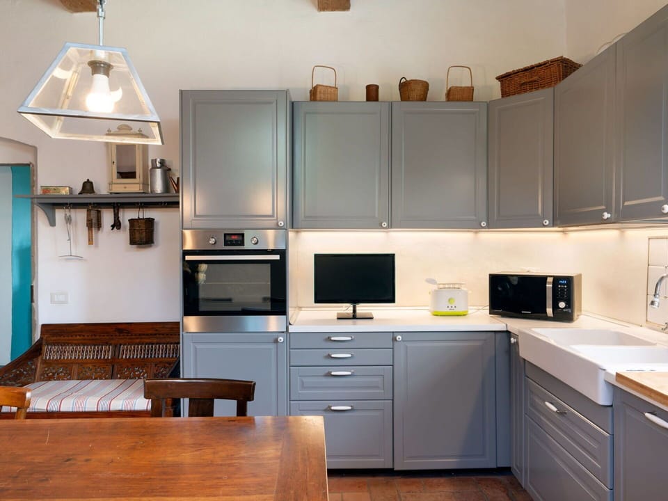Cabinetry, Building, Countertop, Property, Furniture, Drawer, Kitchen Stove, Kitchen Appliance, Wood, Lighting