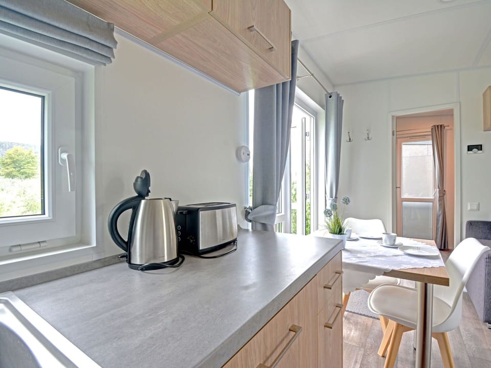 Furniture, Cabinetry, Countertop, Building, Wood, Kitchen, Tableware, Table, Kitchen Appliance, Interior Design