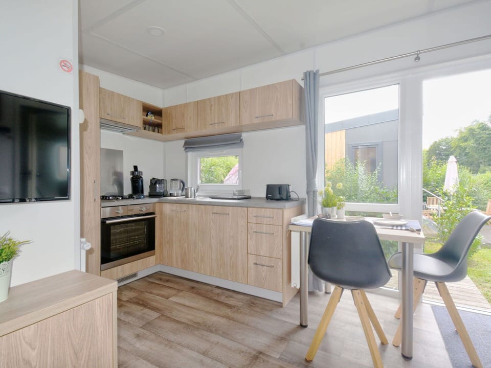 Furniture, Cabinetry, Countertop, Plant, Building, Wood, Flooring, Chair, Floor