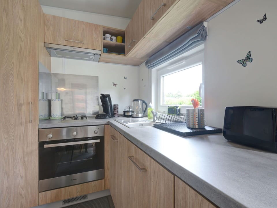 Cabinetry, Property, Countertop, Sink, Building, Kitchen Sink, Tap, Kitchen Stove, Wood, Kitchen Appliance