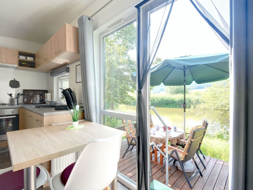 Property, Table, Furniture, Plant, Chair, Wood, Shade, Countertop, Cabinetry, Kitchen