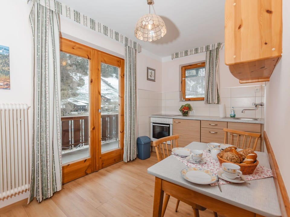 Table, Property, Furniture, Cabinetry, Wood, Interior Design, Lighting, Orange, Living Room, Kitchen