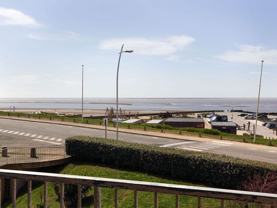 Cloud, Sky, Plant, Street Light, Natural Environment, Road Surface, Land Lot, Coastal And Oceanic Landforms, Asphalt, Road