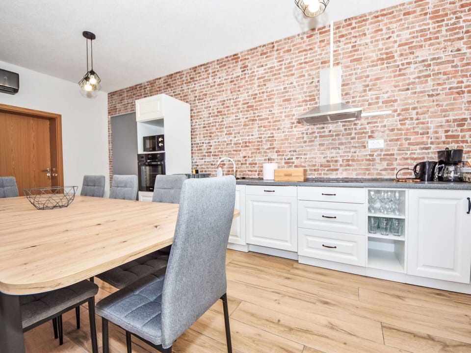Furniture, Cabinetry, Table, Countertop, Wood, Chair, Building, Interior Design, Kitchen, Lighting