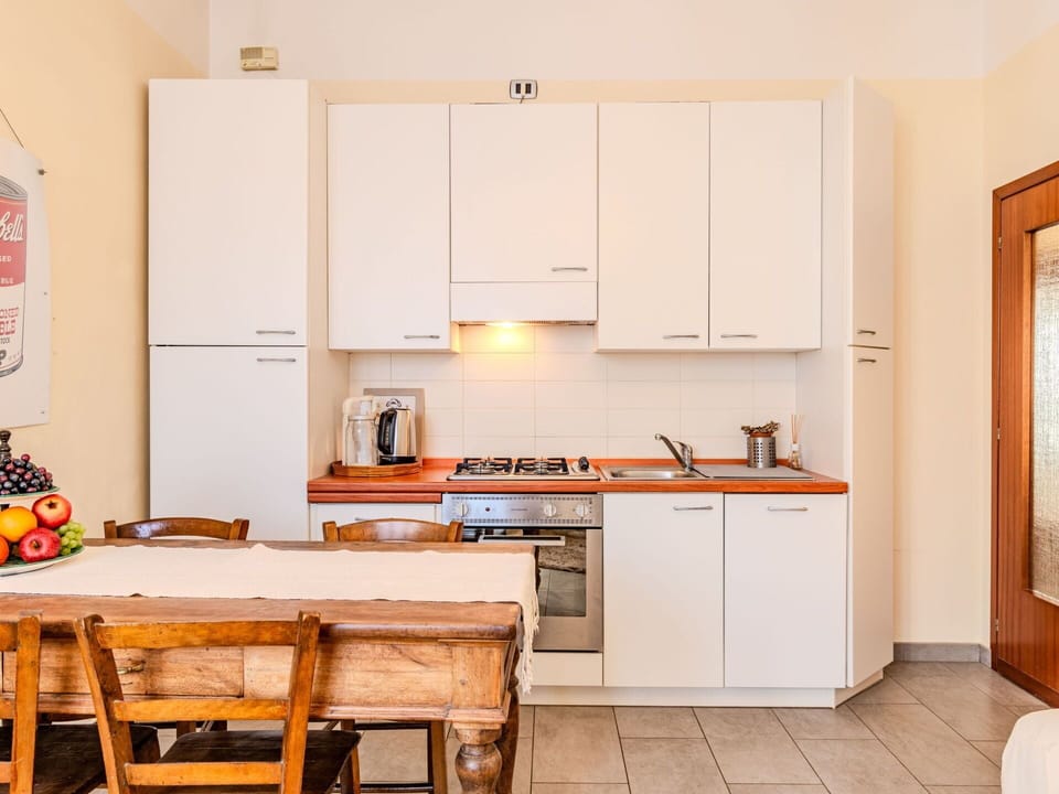 Cabinetry, Furniture, Countertop, Kitchen Stove, Wood, Kitchen, Kitchen Appliance, Orange, Floor, Flooring
