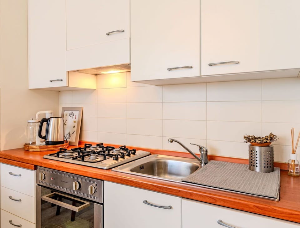 Countertop, Cabinetry, Kitchen Sink, Sink, Kitchen Stove, Kitchen, Kitchen Appliance, Tap, Wood, Home Appliance