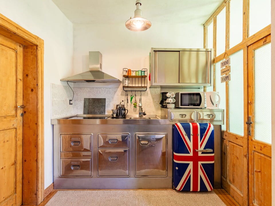 Cabinetry, Countertop, Kitchen Appliance, Wood, Kitchen Stove, Kitchen, Drawer, Interior Design, Flooring, Floor