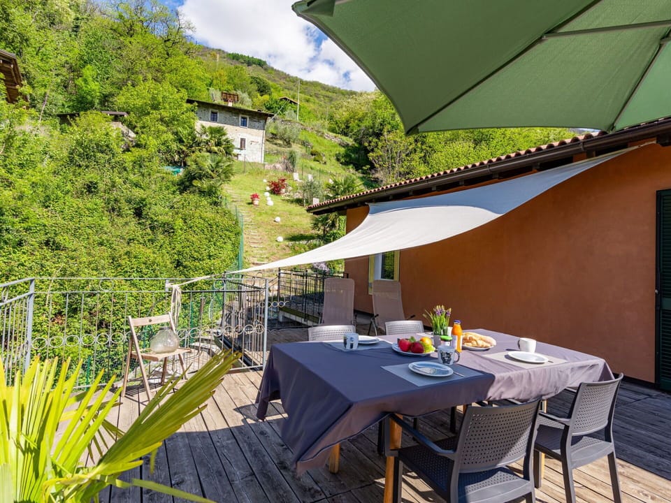 Table, Property, Furniture, Plant, Building, Chair, Shade, Outdoor Furniture, Outdoor Table, Cloud