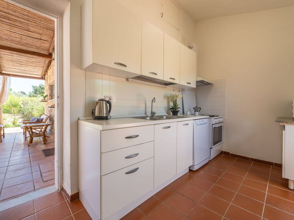 Cabinetry, Countertop, Furniture, Kitchen, Wood, Drawer, Interior Design, Chair, Building, Flooring