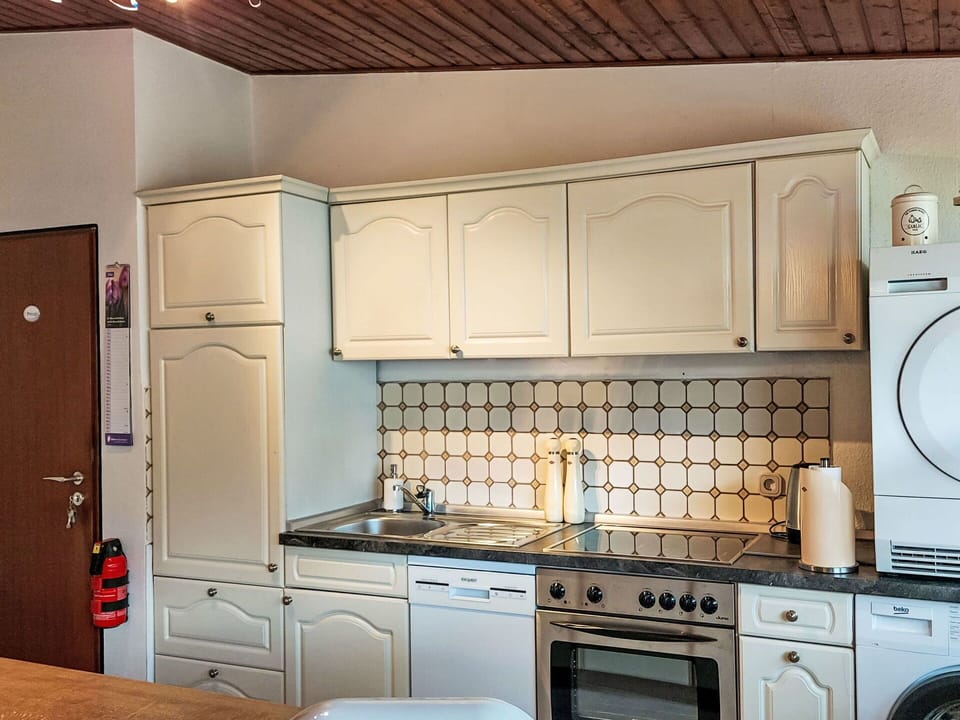 Cabinetry, Property, Kitchen Appliance, Countertop, Kitchen Stove, Gas Stove, Building, Cooktop, Kitchen, Home Appliance