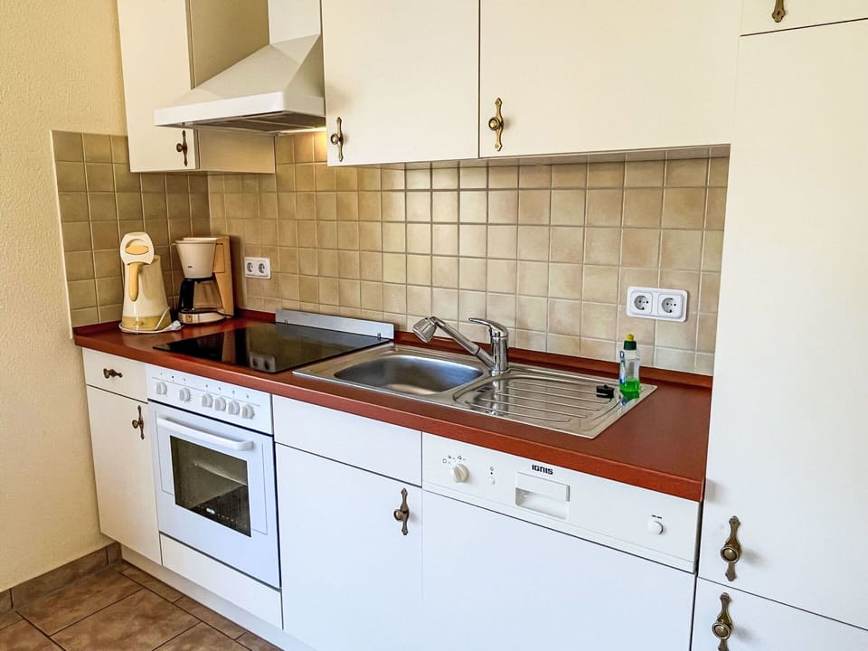 Tap, Cabinetry, Kitchen Sink, Sink, Countertop, Building, Plumbing Fixture, Kitchen Stove, Kitchen, Wood
