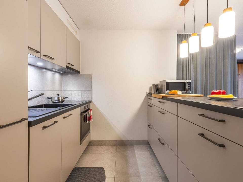 Countertop, Cabinetry, Property, Kitchen Stove, Tap, Kitchen, Kitchen Sink, Wood, Kitchen Appliance, Lighting