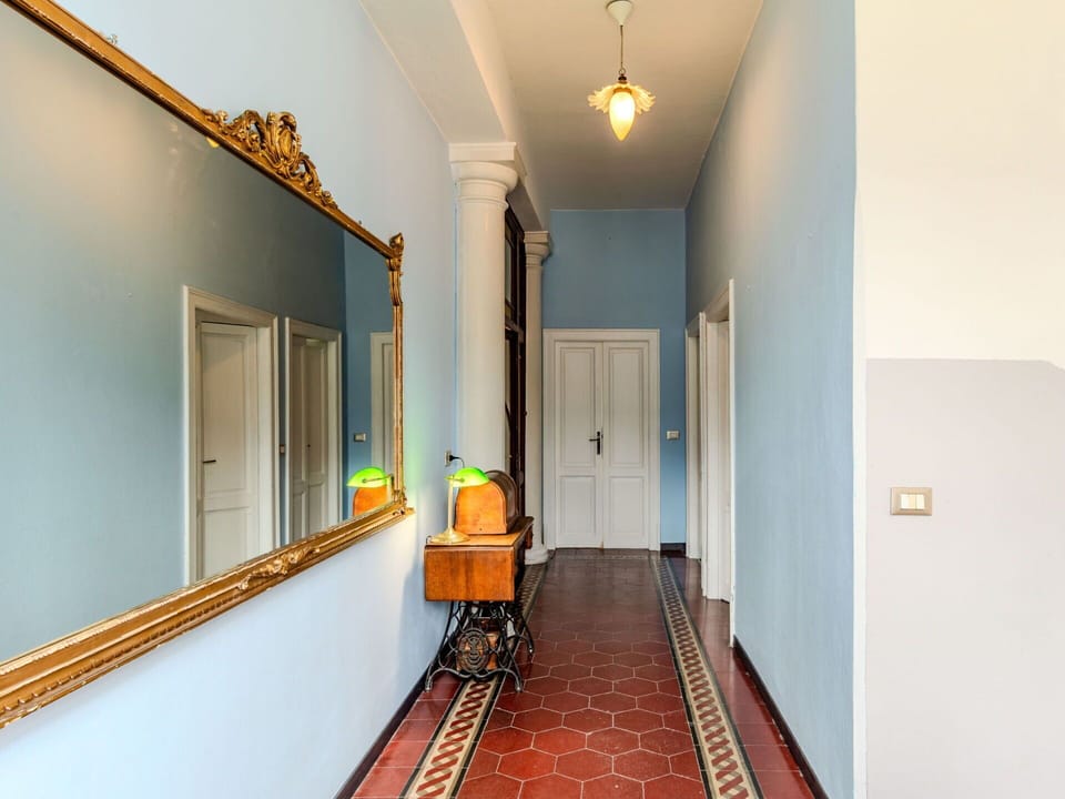 Wood, Lighting, Orange, Interior Design, Hall, Building, Door, Flooring, Floor, Real Estate