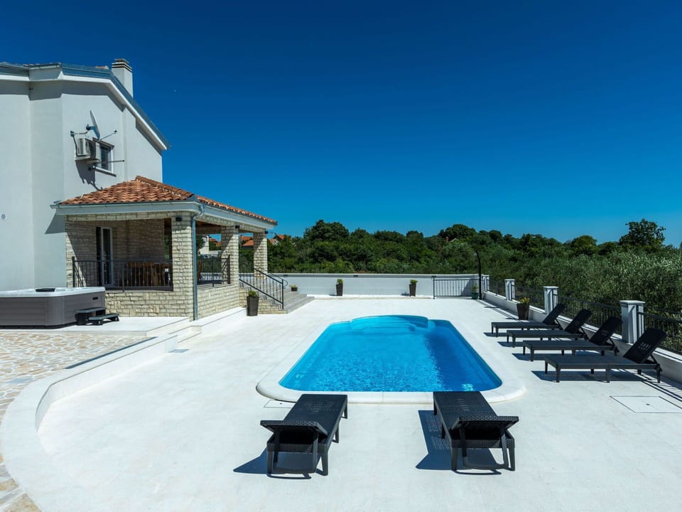 Sky, Azure, Shade, Building, Outdoor Furniture, Water, Swimming Pool, House, Rectangle, Leisure
