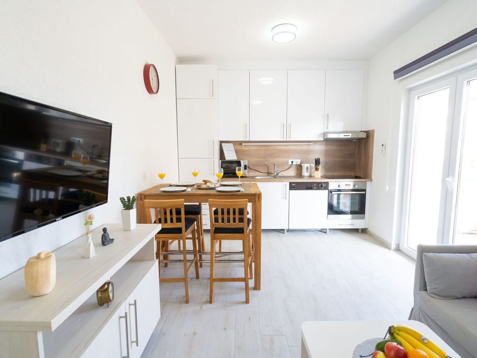 Cabinetry, Furniture, Table, Kitchen, Countertop, Window, Wood, Building, Home Appliance, Flooring