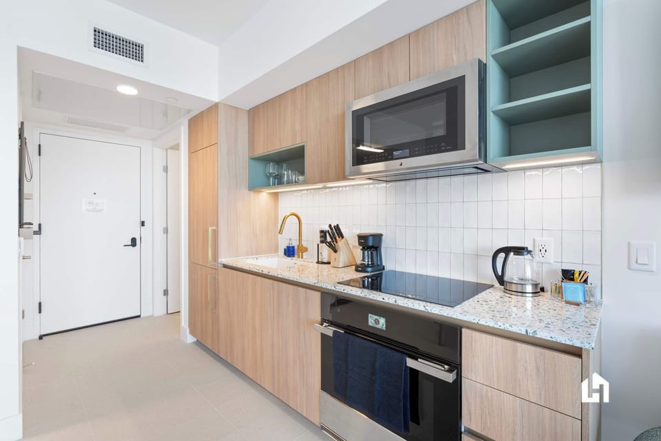 Whip up delicious meals in your sleek, fully equipped modern kitchen.
