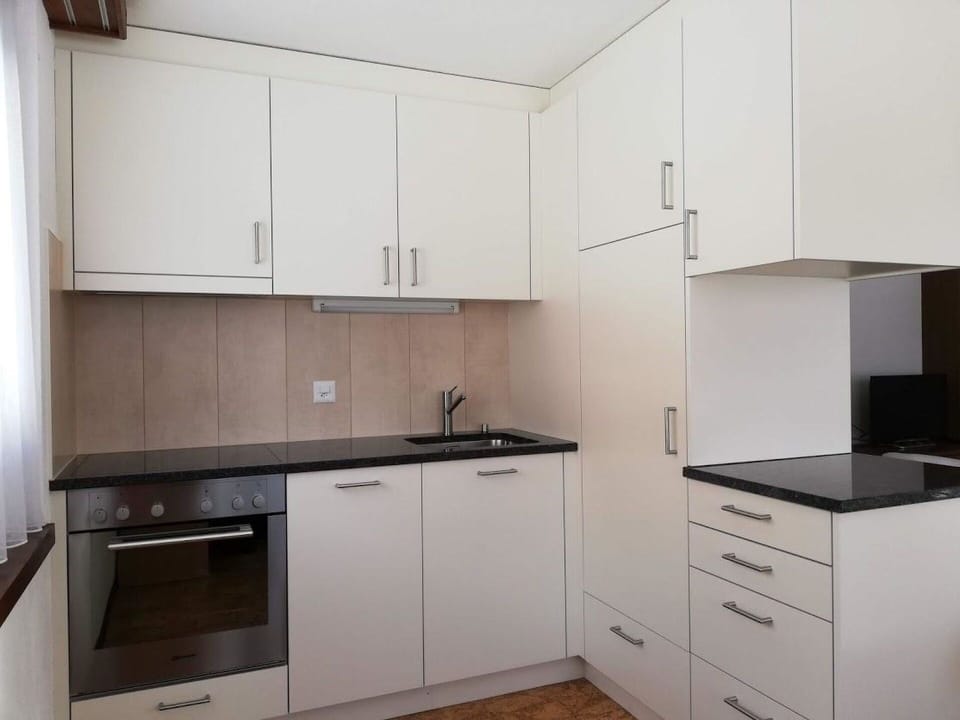 Cabinetry, Countertop, Building, Kitchen Sink, Sink, Kitchen Appliance, Tap, Kitchen Stove, Kitchen, Wood