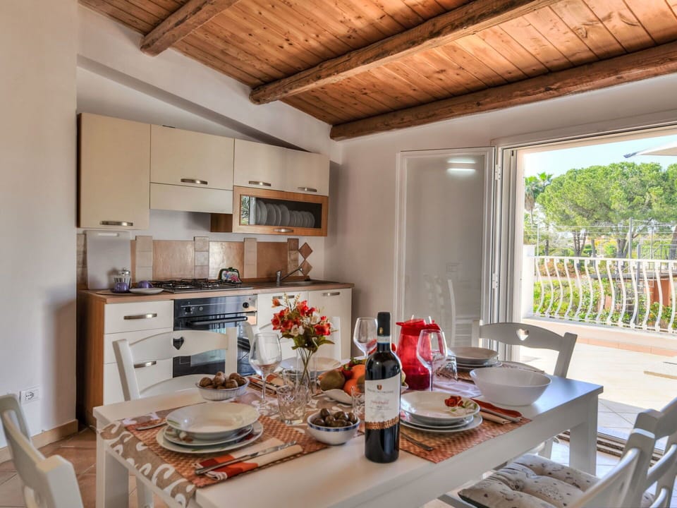 Table, Furniture, Property, Tableware, Cabinetry, Countertop, Chair, Kitchen, Kitchen Appliance, Bottle