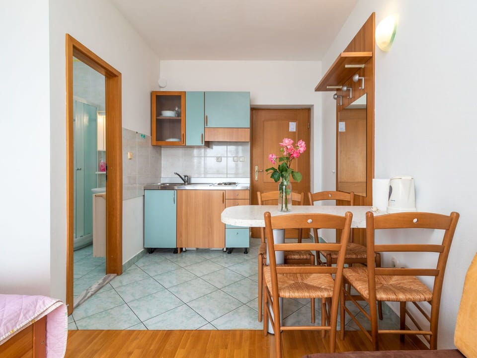 Cabinetry, Furniture, Property, Table, Chair, Wood, Interior Design, Lighting, Floor, Countertop