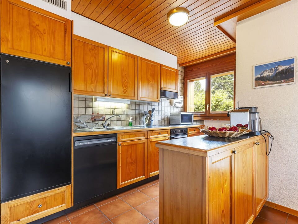 Cabinetry, Countertop, Property, Kitchen Appliance, Kitchen Stove, Wood, Interior Design, Home Appliance, Kitchen, Flooring