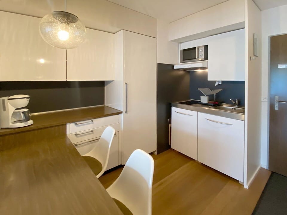Cabinetry, Property, Countertop, Wood, Lighting, Kitchen, Chair, Interior Design, Building, Flooring