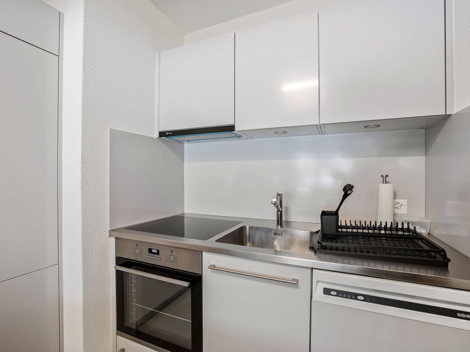 Cabinetry, Kitchen Sink, Sink, Countertop, Tap, Kitchen Stove, Building, Kitchen, Interior Design, Home Appliance