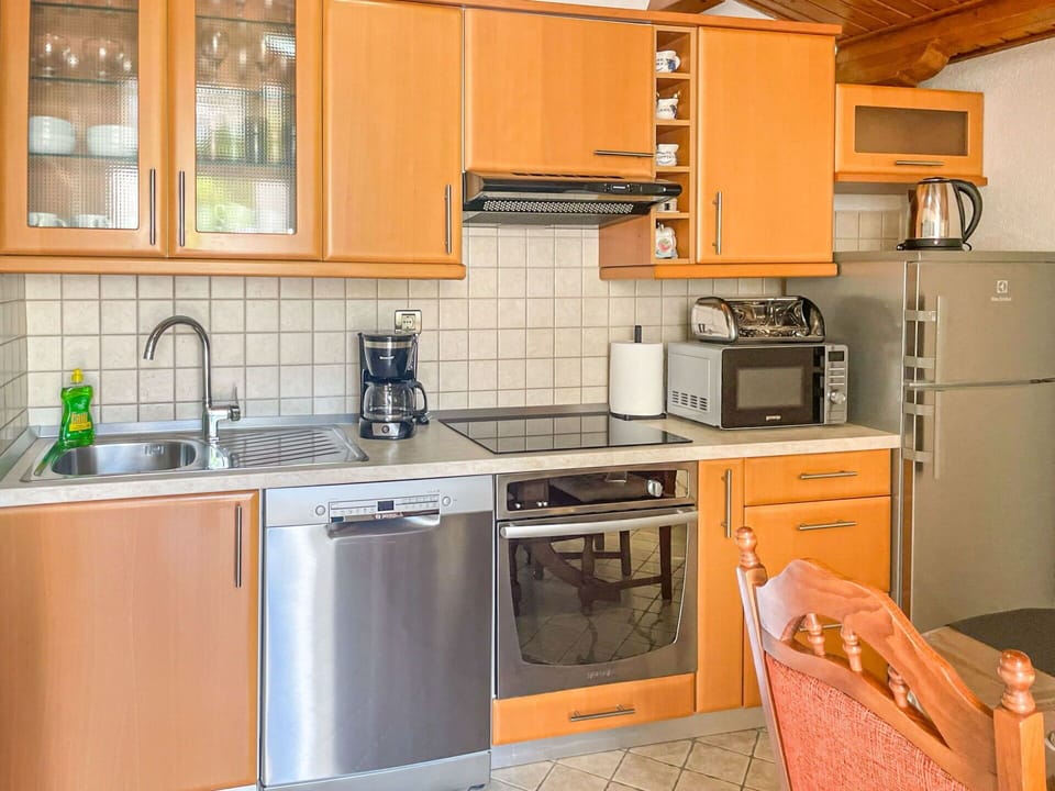 Countertop, Cabinetry, Kitchen Sink, Sink, Kitchen Stove, Kitchen Appliance, Window, Building, Gas Stove, Kitchen