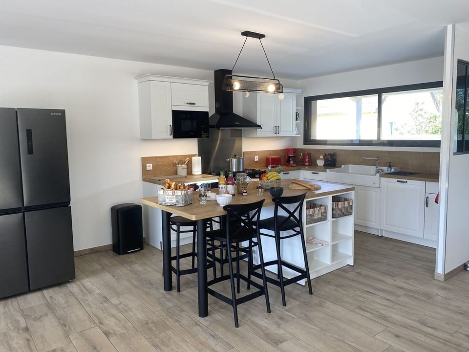 Furniture, Interior Design, Kitchen, Flooring, Kitchen Appliance, Countertop, Wood, Floor, Cabinetry, Ceiling