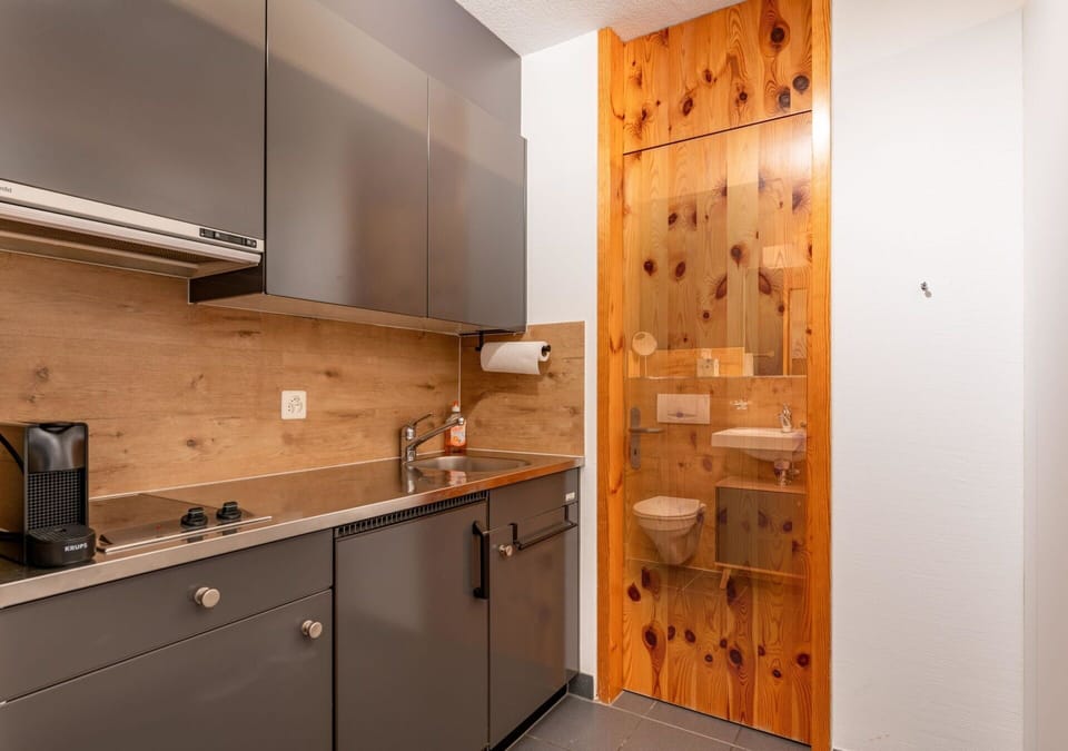 Building, Cabinetry, Countertop, Property, Furniture, Tap, Wood, Kitchen, Interior Design, Drawer