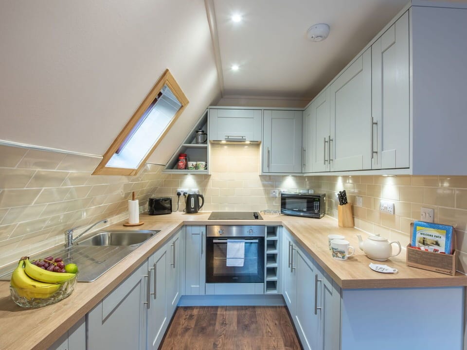 Kitchen, Interior Design, Wood, Countertop, Flooring, Kitchen Appliance, Major Appliance, Ceiling, Cabinetry, Floor