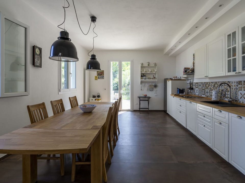 Furniture, Cabinetry, Table, Property, Window, Countertop, Lighting, Picture Frame, Wood, Interior Design