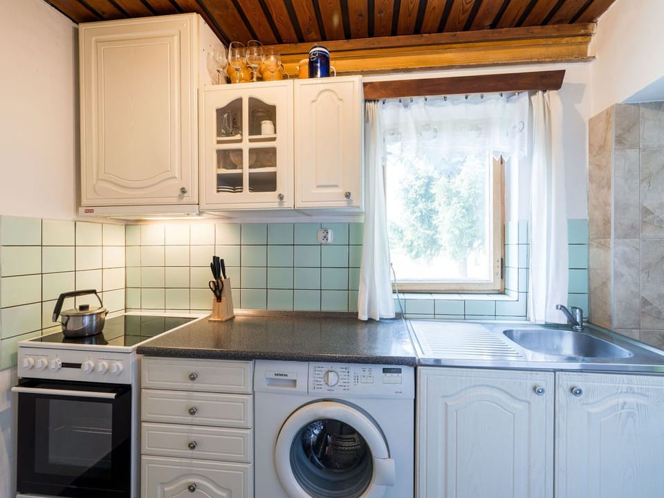 Cabinetry, Kitchen Sink, Property, Laundry Room, Countertop, Kitchen Stove, Building, Kitchen, Sink, Tap
