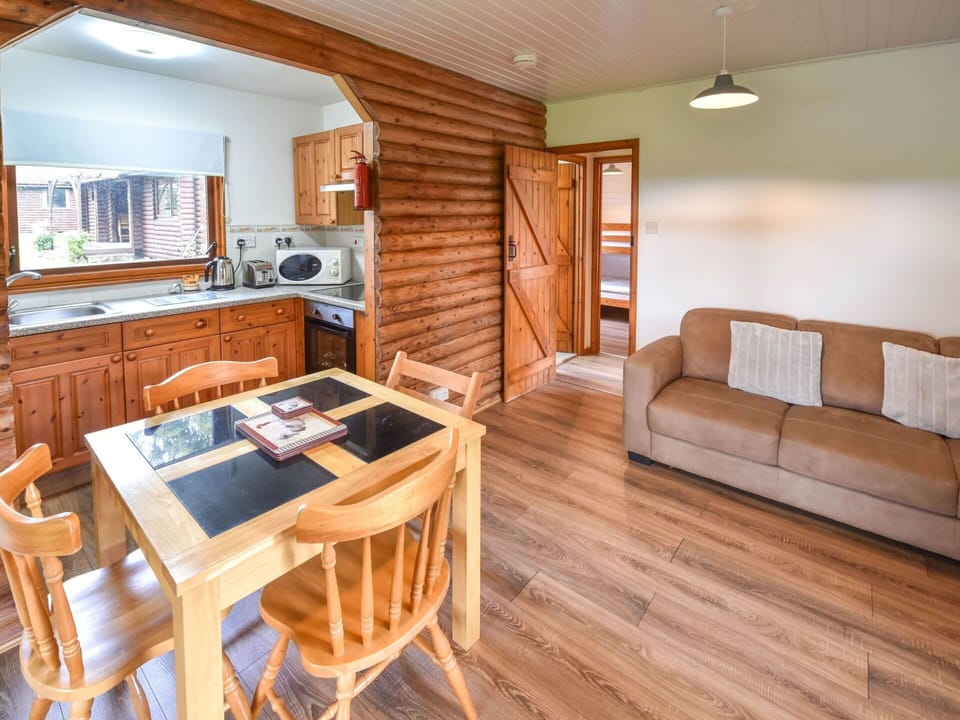 Furniture, Table, Cabinetry, Couch, Chair, Wood, Interior Design, Wood Stain, Floor, Flooring