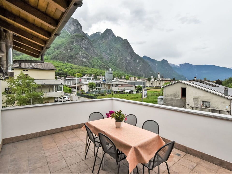 Cloud, Sky, Building, Mountain, Property, Furniture, Table, Plant, Chair, Wood