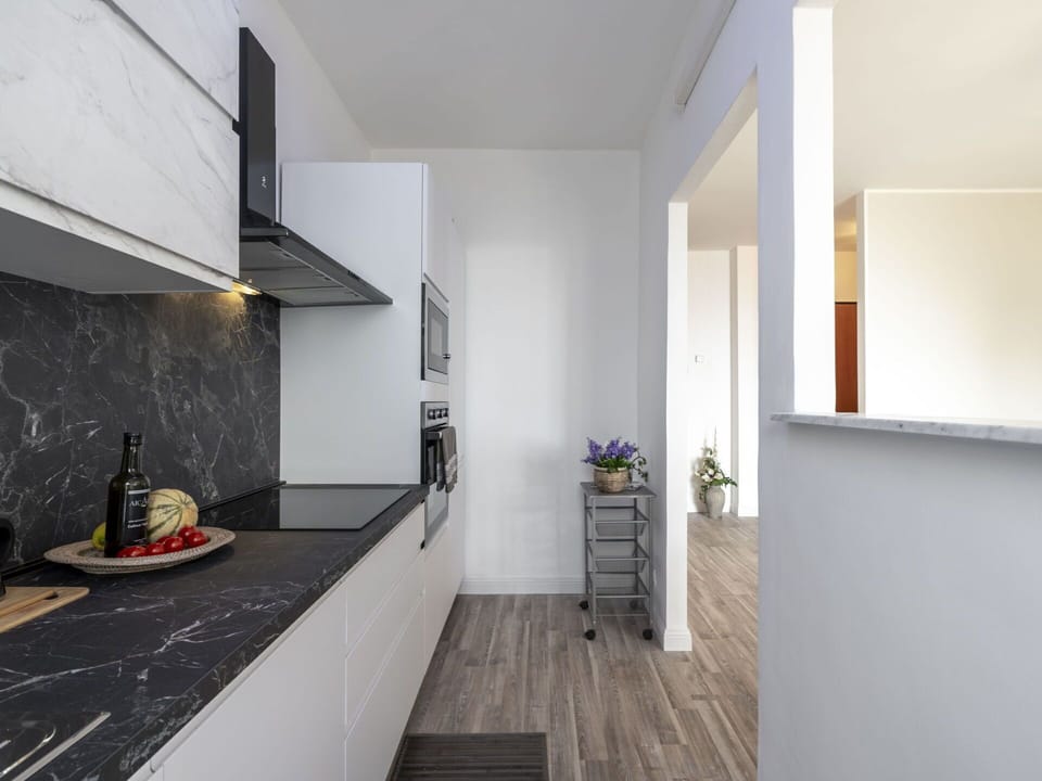 Countertop, Cabinetry, Wood, Interior Design, Flooring, Floor, Kitchen Stove, Hall, Kitchen