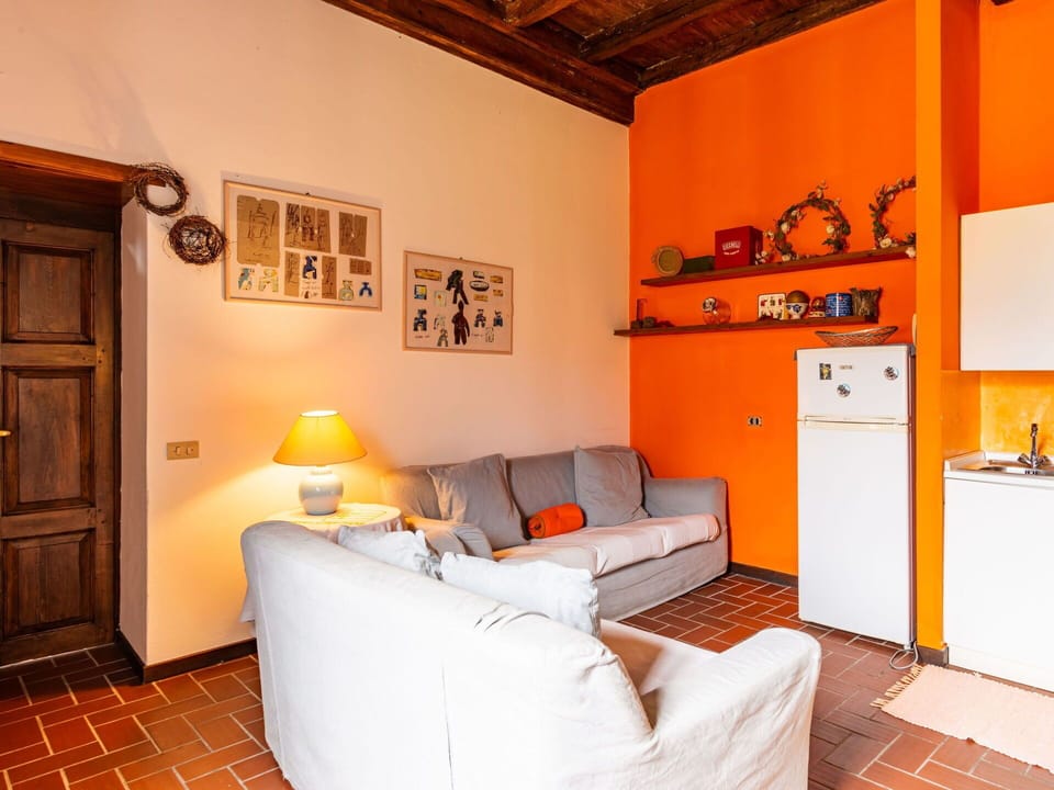 Property, Furniture, Cabinetry, Picture Frame, Comfort, Orange, Wood, Interior Design, Lighting, Lamp