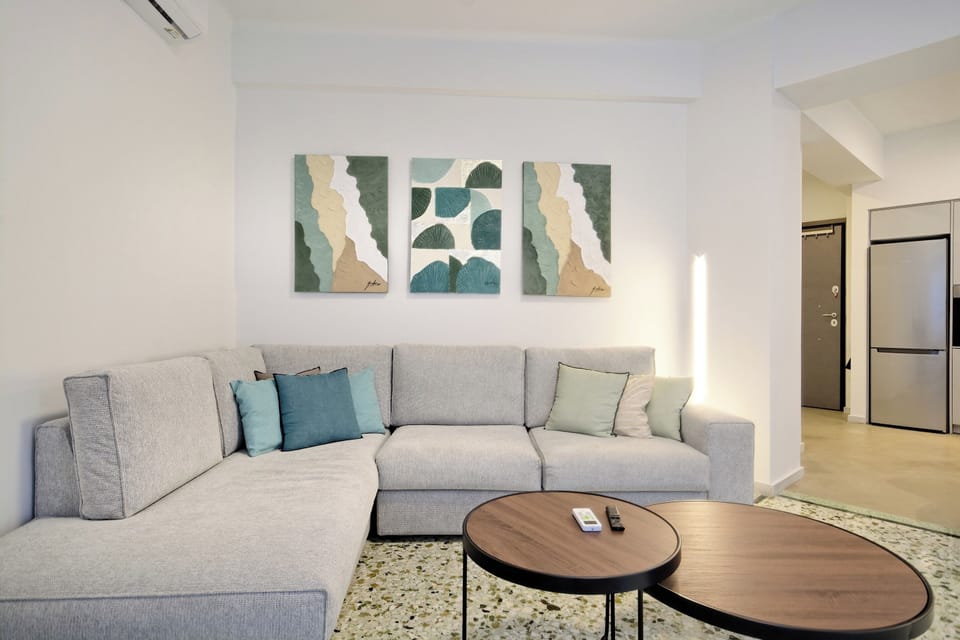 Cozy living room with a large sofa, stylish décor, and relaxing ambiance