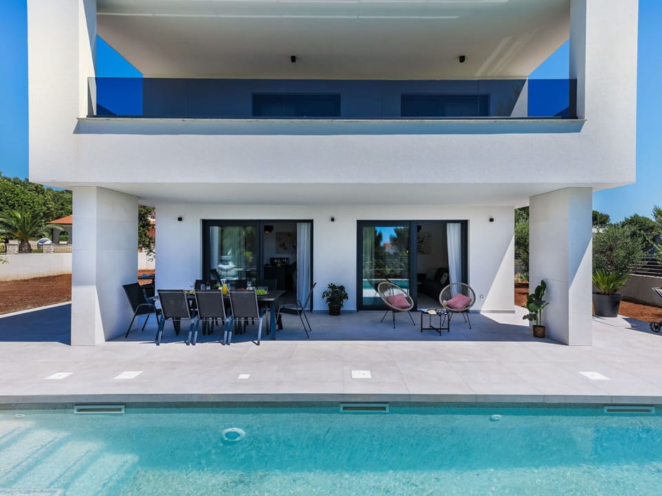 Water, Plant, Property, Azure, Shade, Building, Swimming Pool, Outdoor Furniture, Window, Umbrella