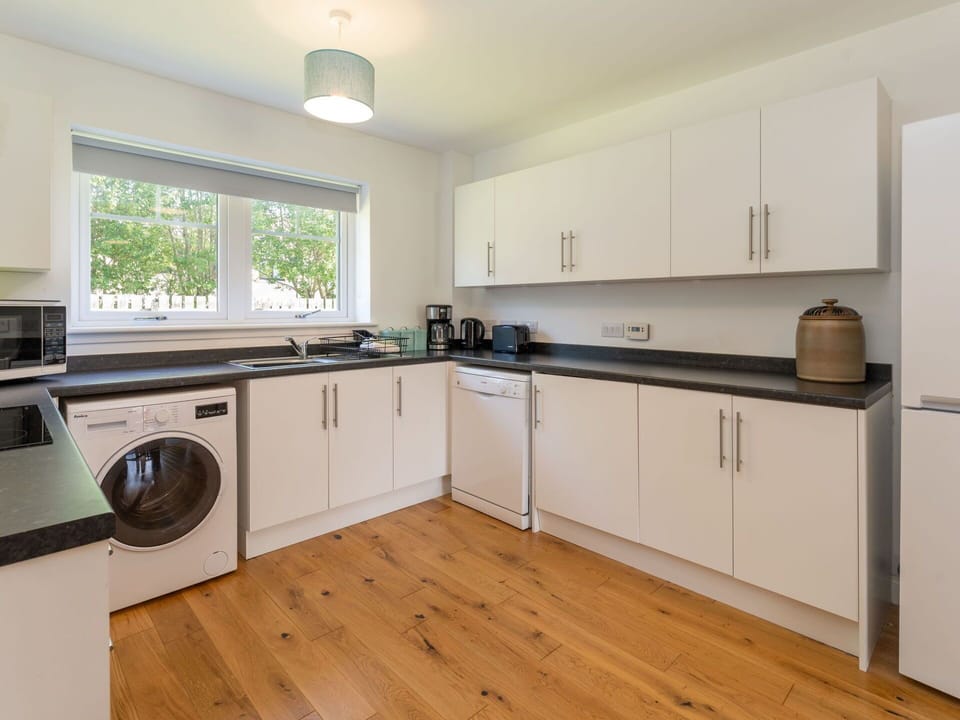 Cabinetry, Countertop, Property, Kitchen Sink, Kitchen Stove, Sink, Kitchen, Wood, Kitchen Appliance, Window