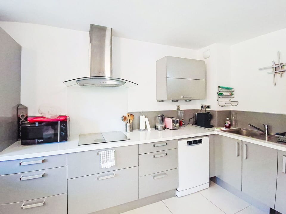 Kitchen, Kitchen Appliance, Countertop, Cabinetry, Major Appliance, Furniture, Flooring, Interior Design, Home Appliance, Drawer