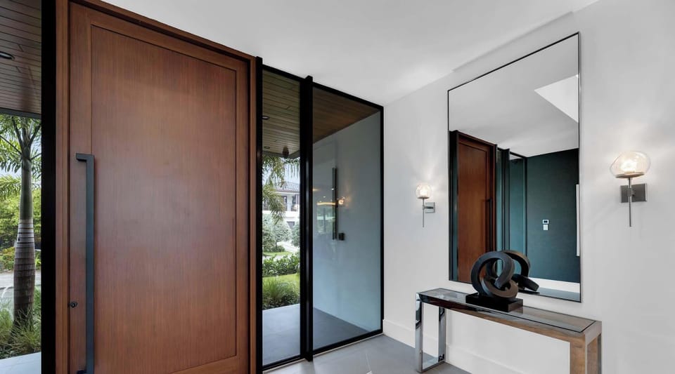 The entrance to Villa Carlotta is marked by a grand, elegant door that immediately captivates with its commanding presence.