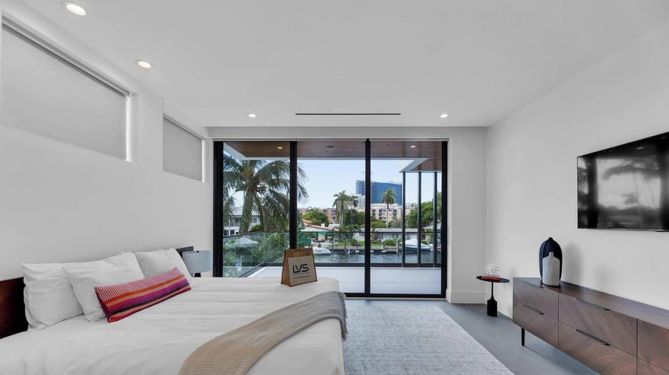 5th Suite (South Facing / 2nd Floor):  -King Size Bed -Walk In Closet -Expansive Balcony -Lounge Chair with Ottoman -Dresser -Smart TV -Ensuite Bathroom with Shower