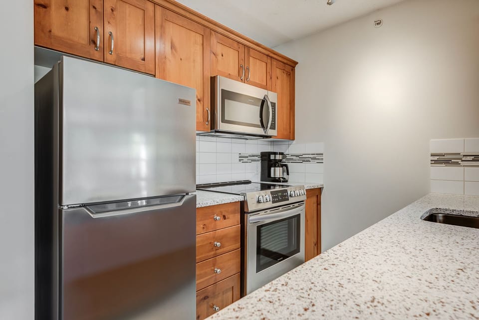 Well-equipped kitchen with modern appliances and ample counter space.