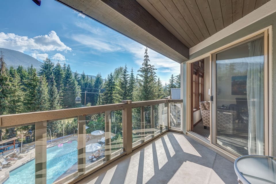 Scenic balcony with forest and mountain views, great for fresh air.