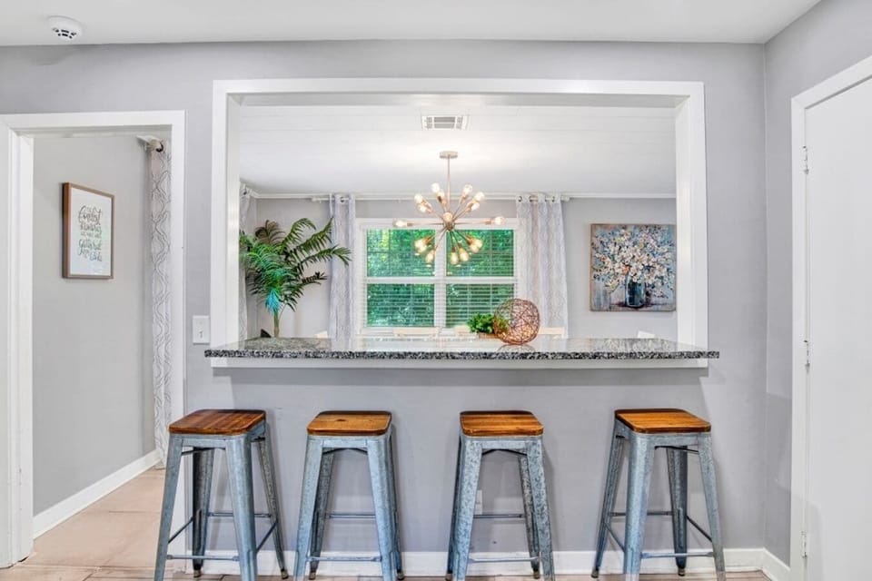 Cozy breakfast nook with a charming view overlooking the dining area, perfect for enjoying morning coffee or casual meals.