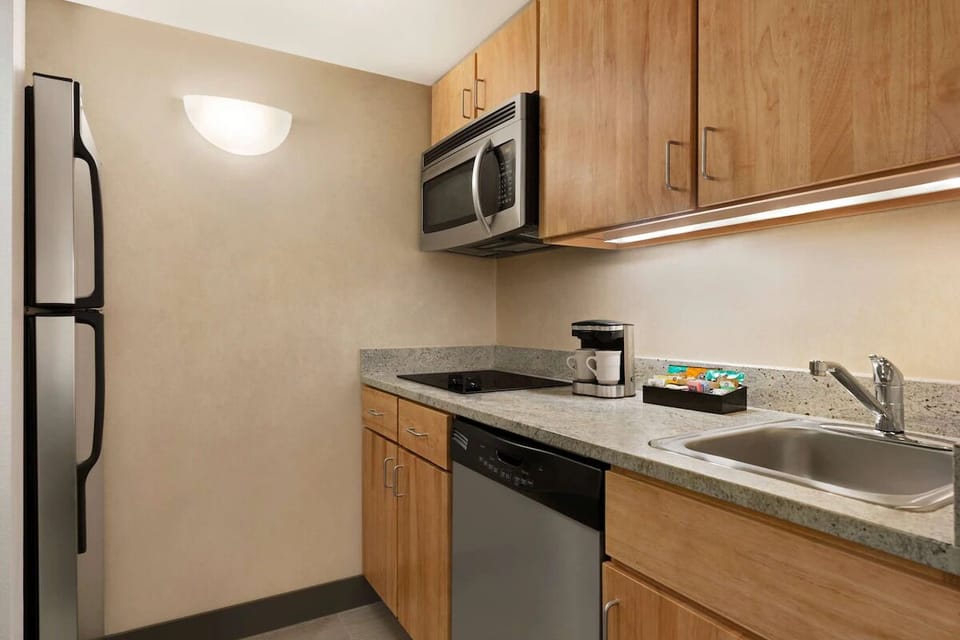 Brew morning coffee and prep snacks in the sleek kitchenette.