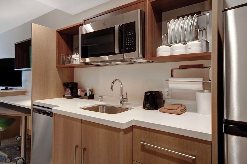 Start mornings with fresh coffee and an easy in-room kitchenette.